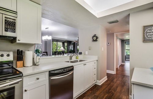 Bonita Bay Condo | Spacious, air-conditioned condo with private W/D, beach shuttle, & central AC