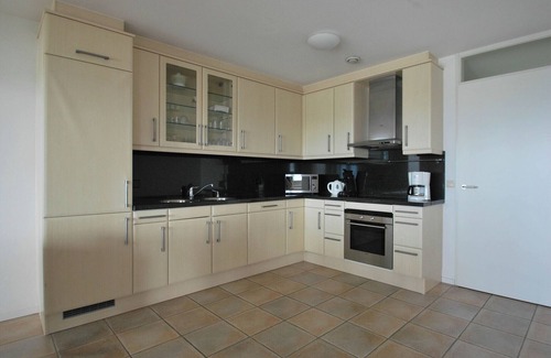 Makkum Apartment | Spacious apartment with a large balcony and a view of the IJsselmeer at a luxurious resort in Friesland.