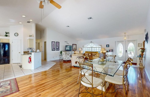 Biggar Villa | Spacious Lakefront Home with a Screened-In Pool in Exclusive Community