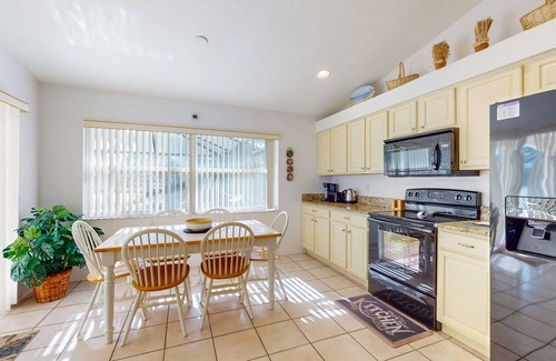 Biggar Villa | Spacious Lakefront Home with a Screened-In Pool in Exclusive Community