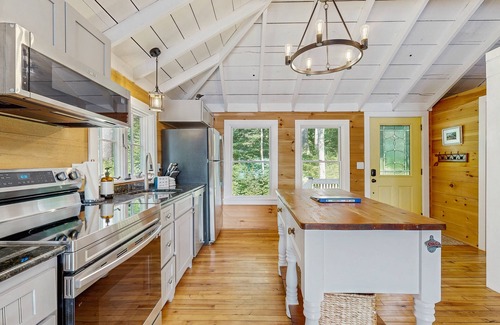 Union House | Spacious lakefront home with stunning views, hot tub, fire pit, dock & swimming