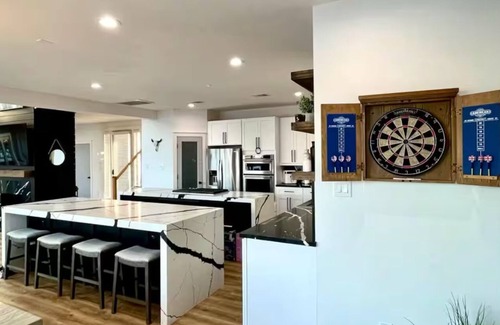 April Sound House | Spacious Luxury Lakefront Home with Pool and Jacuzzi, Firepit, and Game Room!