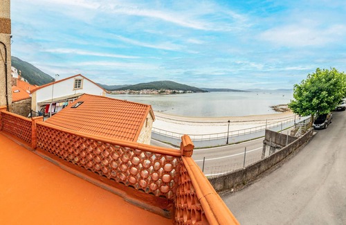Muros Apartment | Spend a wonderful vacation in this inviting apartment by the sea.