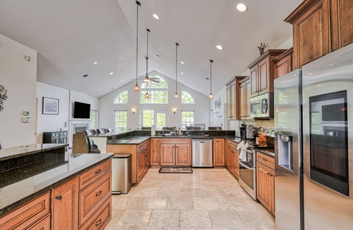 Morgan II House | Sprawling waterfront home with a boat launch, kayaks, game room, and hot tub
