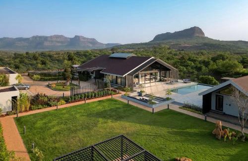 Lonavala Villa | StayVista's The Barn - Mountain-View Luxury Mansion with Heated Infinity Pool, Deck, Jacuzzi, Lawn featuring a Gazebo and Firepit