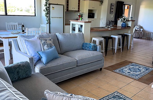 North Ward Apartment | Steps from The Strand 2BR & 2BA Riviera Retreat, Pool & Castle Hill Views