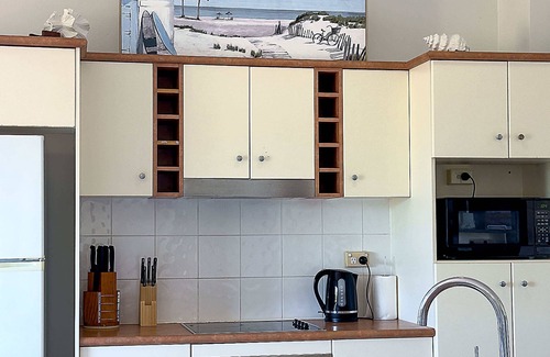 North Ward Apartment | Steps from The Strand 2BR & 2BA Riviera Retreat, Pool & Castle Hill Views