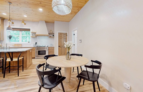 Foscoe Cottage | Stunning dog-friendly cottage with riverfront patio, hot tub, fire pit, & views