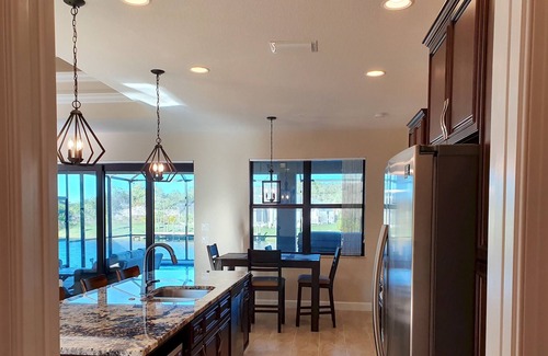 South Gulf Cove Villa | Stunning home, pool overlooking river, free wifi, bikes, BBQ. Near beaches