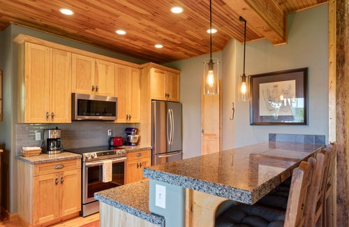 Coeur d'Alene House | Stunning mountain escape with lake views, expansive furnished deck & firepit - dog-friendly