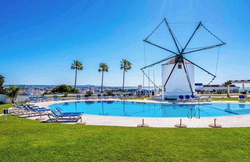 Patio Condo | Stunning views of Sunrise & Sunset WindMill Rooftop Condo by BeCherish