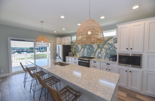 Long Neck House | Stunning-waterfront, beach, pools, family fun