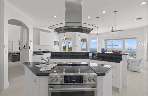 Caloosahatchee House | Stunning Waterfront Home With Heated Pool, Hot Tub, Boat Dock + Game Room