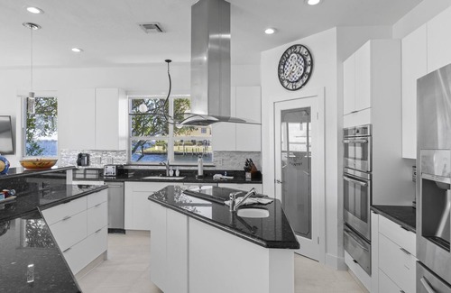Caloosahatchee House | Stunning Waterfront Home With Heated Pool, Hot Tub, Boat Dock + Game Room