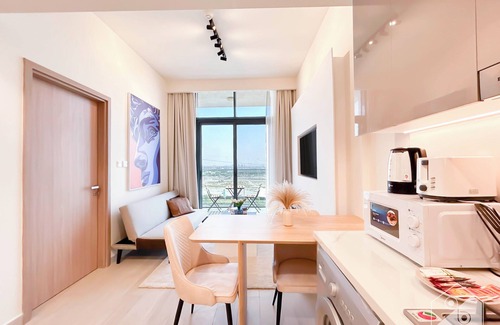 Nad Al Sheba Apartment | Stylish 1BR with Balcony in Azizi Riviera
