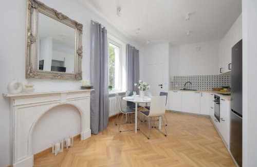 Sielce Apartment | Stylish One Bedroom Apartment in Warsaw with Balcony by Noclegi Renters