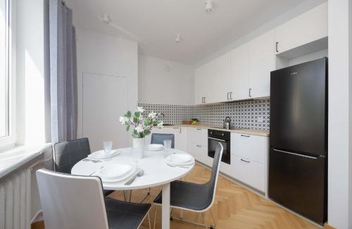 Sielce Apartment | Stylish One Bedroom Apartment in Warsaw with Balcony by Noclegi Renters