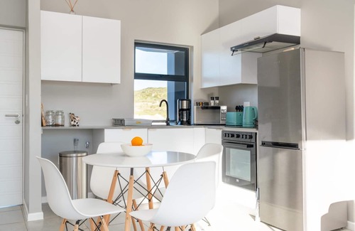 Mykonos Apartment | Stylish Urban Stay | Balcony | Lagoon View