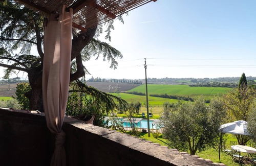 Castiglione del Lago Apartment | Suite with panoramic balcony, pool view and beautiful sunsets