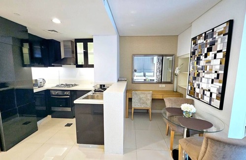 Downtown Dubai Apartment | Sunrise Homes - Chic Studio close to Dubai Mall with Canal Views