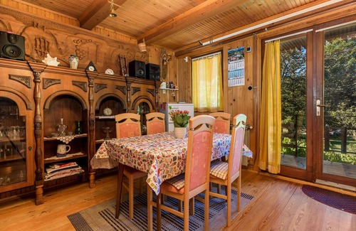Zlobin House | Surrounded by pine trees is this small cottage.