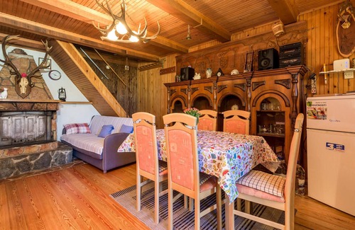 Zlobin House | Surrounded by pine trees is this small cottage.