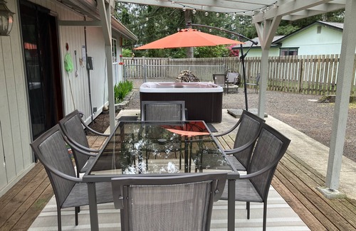 Forks House | Surrounded by trees, this 3-bedroom, fully stocked retreat sleeps 8.