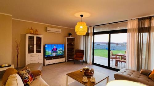 Ad-Dab'ah House | Swan Lake North Coast Luxurious Chalet with Garden