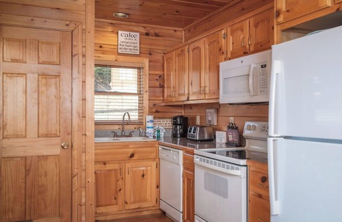 Gatlinburg - Pigeon Forge Resort | Sweet Slice of Heaven is a warm and inviting two-bedroom cabin