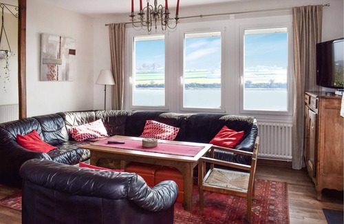 Plouguiel House | Take a vacation in this beautiful country house with rustic furnishings and a view of the water.