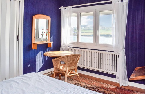 Plouguiel House | Take a vacation in this beautiful country house with rustic furnishings and a view of the water.