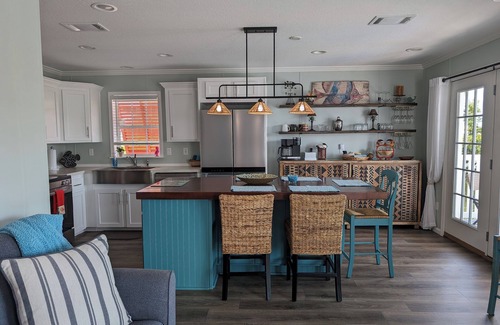 Saint James City Cottage | Tangerine Dream Tropical Pool and Canal Retreat