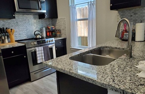 Montgomery House | The Beaver Den welcomes 30 day stays remote workers King bed Lake Conroe