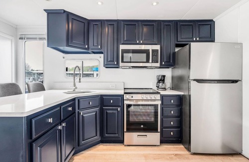 Celina Boat Rental | The Castaway Houseboat 53' - Smallest Houseboat, 3 bedrooms, waterslide, covered rooftop lounge area