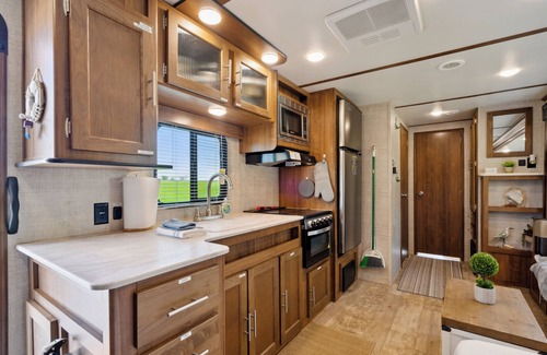 Langworthy RV Rental | The Coastal Conquest Camper Rental, located on Silver Lake in Delhi, IA