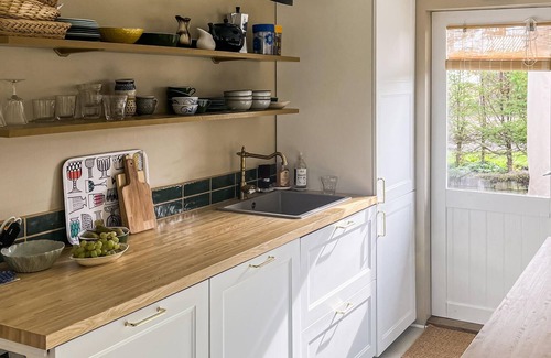 Østerskov House | The cottage is situated on a beautiful natural plot bordering an unfenced marsh.