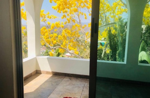 La Manzanilla Apartment | "The Dharma room" a bedroom with a fantastic view.n
