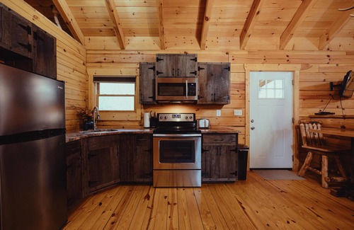 South Bloomingville Cabin | The Escape - Stay at the Escape Cabin in Hocking Hills, OH! Enjoy a cozy stay with a hot tub, fire pit, hiking, waterfalls, and more. Book your getaway today!