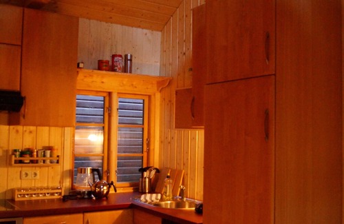 Suderburg House | The holiday home "Ortheide 69" is located in a forest settlement with large trees.