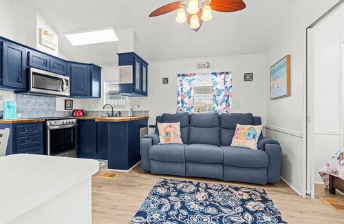 Upper Grand Lagoon House | The Little Love Bug: 2-pup friendly, golf cart, screened porch, near beach/pool