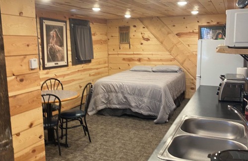 Luverne Cabin | The Little Red Barn - Lakeside Tiny Home Rental -Sleeps 4 - Spiral Staircase