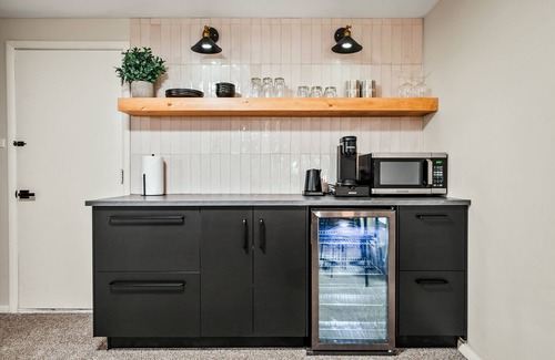 East Colorado Springs Apartment | The Lower Luxe ~ Private Backyard Oasis ~ Hot Tub ~ Fire-Pit ~ Centrally Located