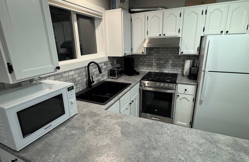 Prince George Apartment | The Paddle On Inn! A canoe-themed basement suite with all the modern finishes!