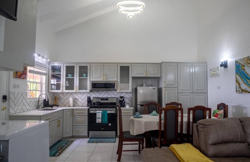 St. George's Apartment | The Pink House Overlooking with the Carenage. Features 2 Person Jacuzzi Tub.