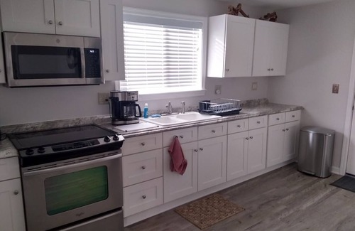 Wilson House | “The Red House” Family friendly vacation home close to beach and lake access.
