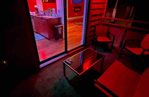 Loring Heights Apartment | The Red Room - Cloud Ceilings - Patio & Bathroom TV