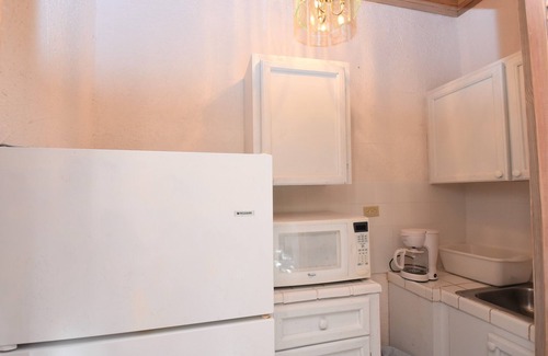 Dunmore Town Apartment | The Sugar Apple Studio 3 minute walk to the beautiful Pink Sand Beach