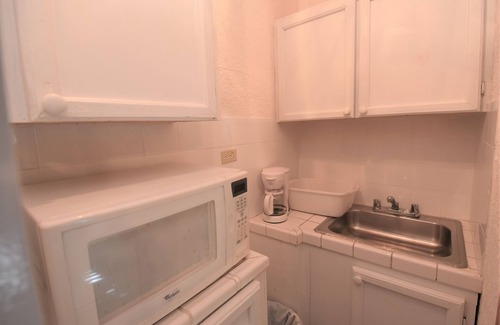 Dunmore Town Apartment | The Sugar Apple Studio 3 minute walk to the beautiful Pink Sand Beach