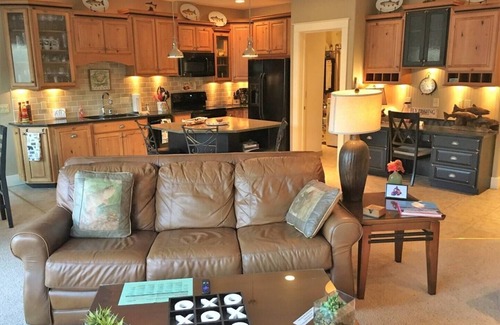 Salida Condo | This riverfront downtown condo boasts and open floor plan for kitchen, living room, and dining areas. Or step onto the balcony over the Arkansas River to hear the water rushing by. Oversized master suite has its own balcony and indoor sitting area.