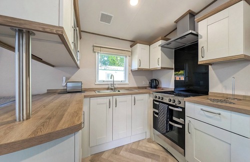 Penrith House | This spacious caravan that sleeps 6 offers everything you need to enjoy your stay at Lowther Park.